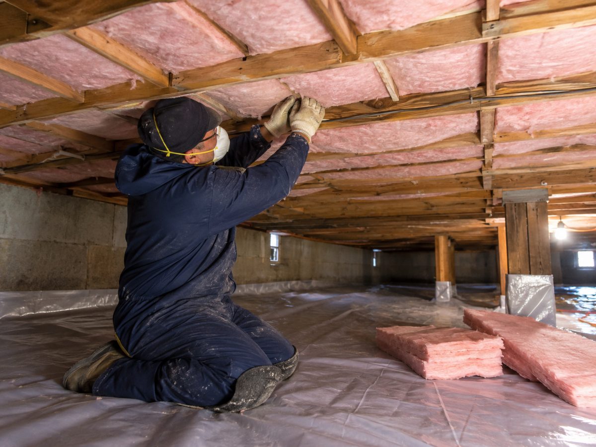 Crawl space with new vapor barrier and insulation installed